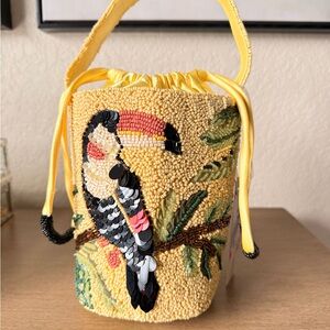 Viral toucan-themed beaded bucket bag